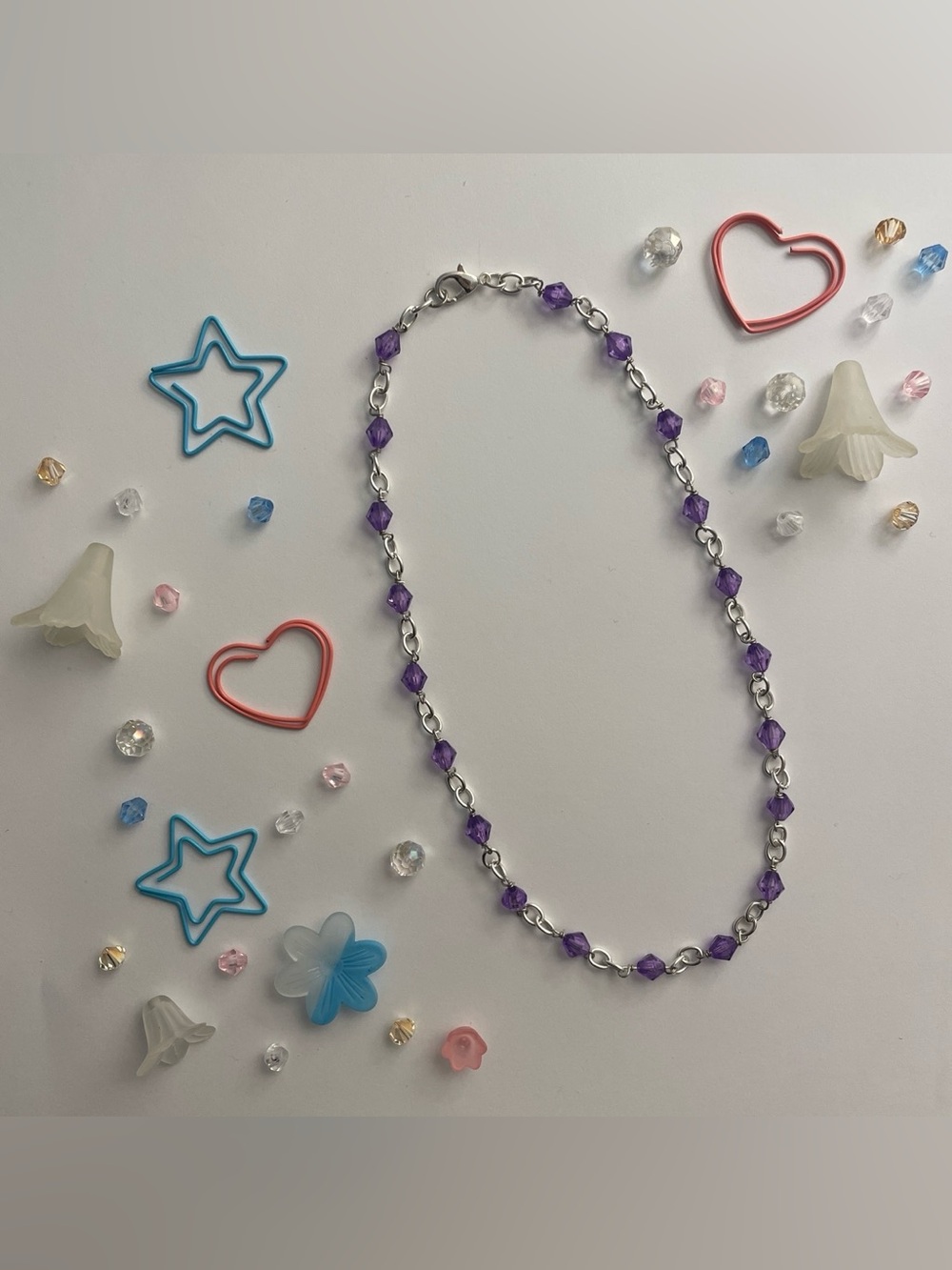 Silver chain necklace with purple beads